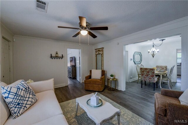 3216 34th Ave, Northport, AL 35476 - living area featuring wood finished floors, a chandelier, ceiling fan, crown molding, and baseboards