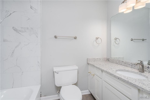 full bathroom featuring baseboards, vanity, and toilet