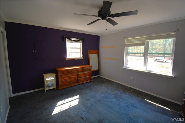 unfurnished bedroom with electric panel, baseboards, ceiling fan, ornamental molding, and dark wood-type flooring