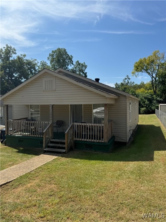 view of front of house featuring a front yard and covered porch