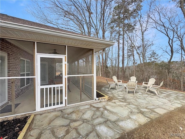 view of patio / terrace featuring a sunroom