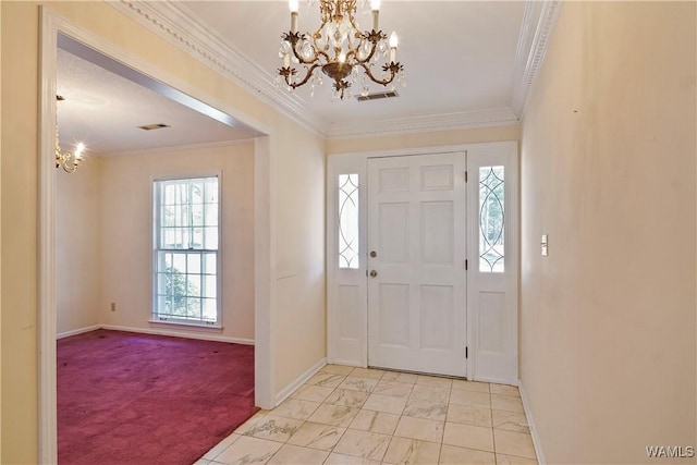 carpeted entryway with a notable chandelier and ornamental molding