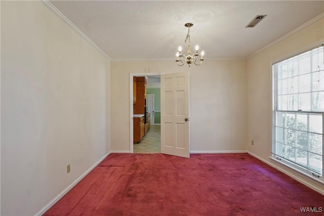 spare room featuring an inviting chandelier, ornamental molding, plenty of natural light, and light carpet