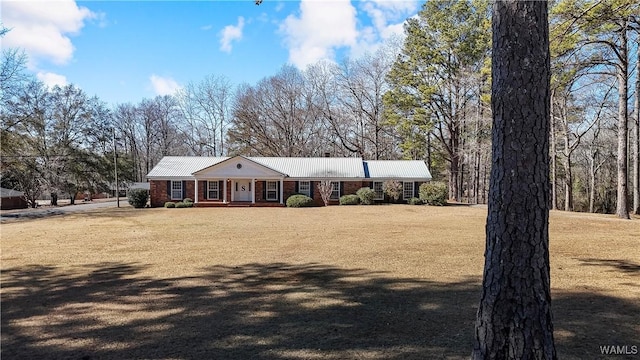 ranch-style home featuring a front yard and a porch