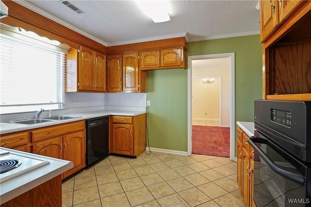 kitchen featuring crown molding, sink, light tile patterned floors, and black appliances