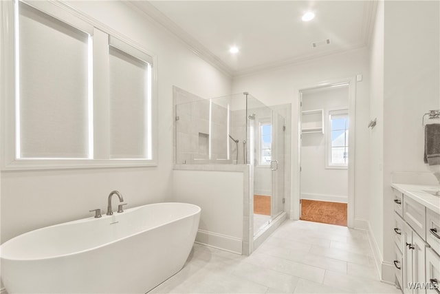 bathroom featuring tile patterned flooring, vanity, independent shower and bath, and ornamental molding