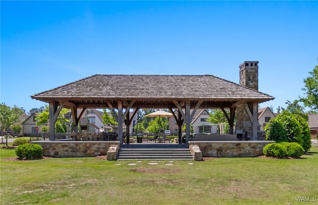 view of property's community with a gazebo and a lawn