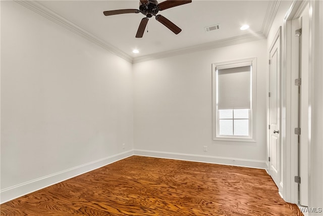 spare room featuring hardwood / wood-style floors, ceiling fan, and ornamental molding