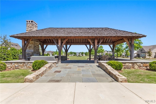 view of community featuring a gazebo and a patio