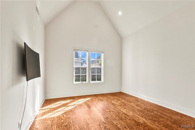 unfurnished living room with light hardwood / wood-style flooring and high vaulted ceiling