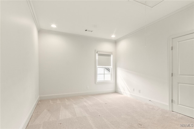 carpeted spare room featuring ornamental molding