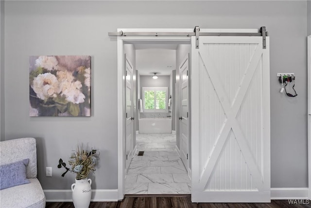 10488 Nicole St, Vance, AL 35490 - hallway with marble finish floors and a barn door