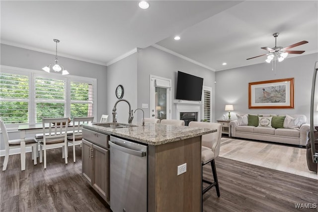 10488 Nicole St, Vance, AL 35490 - kitchen featuring dishwasher, dark wood finished floors, ceiling fan, ornamental molding, and an island with sink