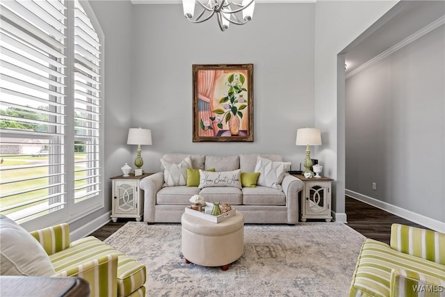10488 Nicole St, Vance, AL 35490 - living room with a chandelier, healthy amount of natural light, crown molding, and dark wood-style flooring