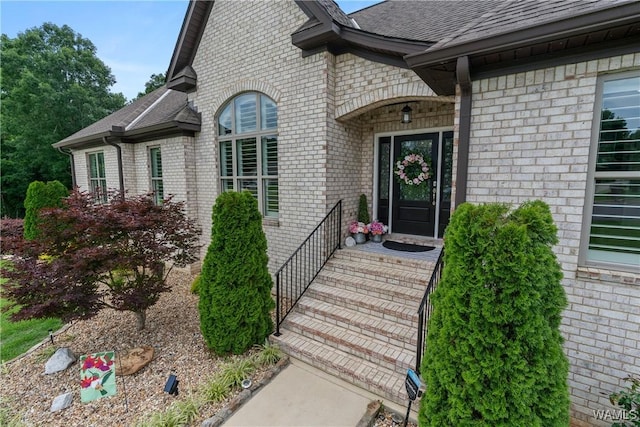 10488 Nicole St, Vance, AL 35490 - view of exterior entry featuring roof with shingles and brick siding