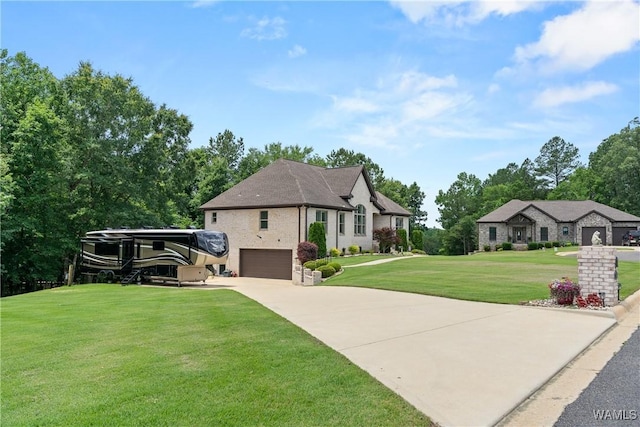 10488 Nicole St, Vance, AL 35490 - french provincial home with a front yard, concrete driveway, and a garage