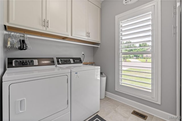 10488 Nicole St, Vance, AL 35490 - laundry area with cabinet space, independent washer and dryer, and light tile patterned floors