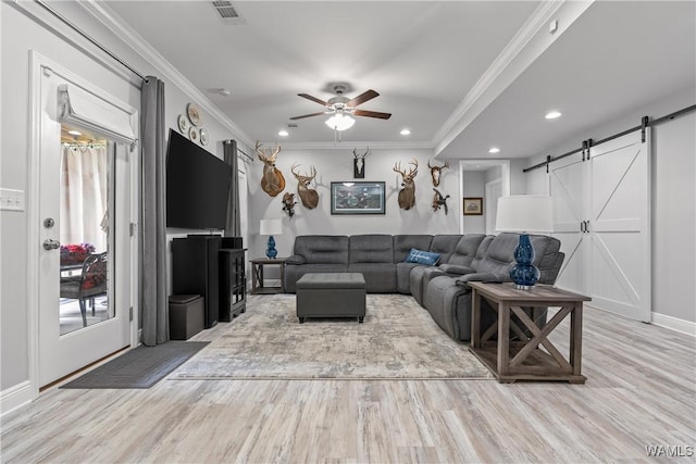 10488 Nicole St, Vance, AL 35490 - living room with a barn door, ceiling fan, wood finished floors, crown molding, and recessed lighting