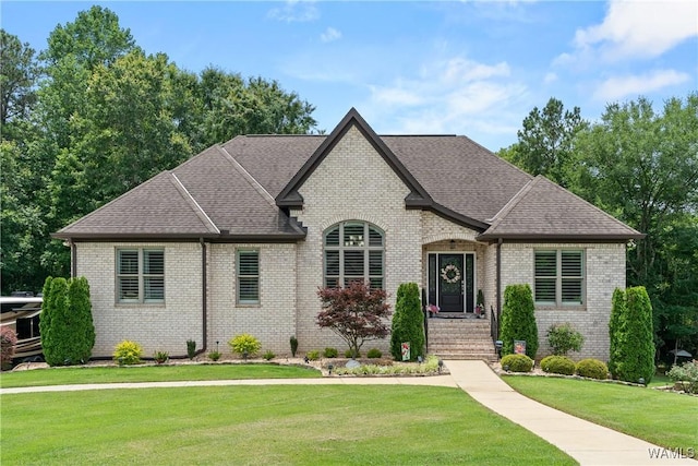 10488 Nicole St, Vance, AL 35490 - french country style house with brick siding, a front yard, and roof with shingles