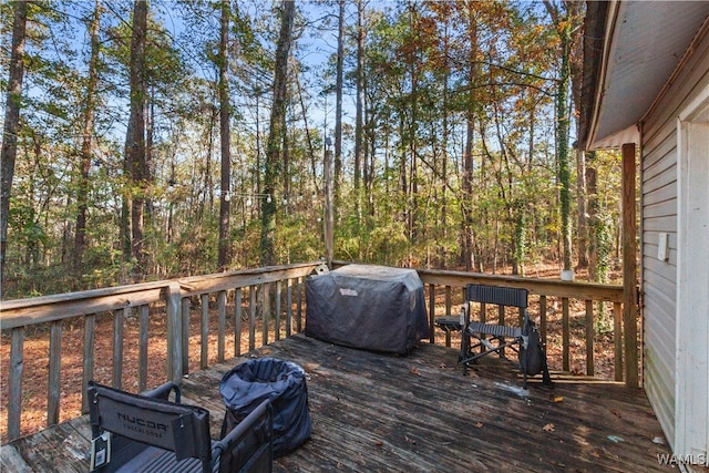 wooden terrace featuring grilling area