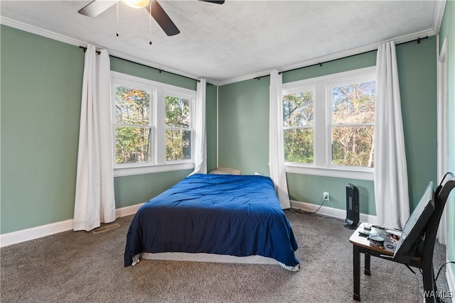 bedroom featuring carpet flooring, ceiling fan, crown molding, and a textured ceiling