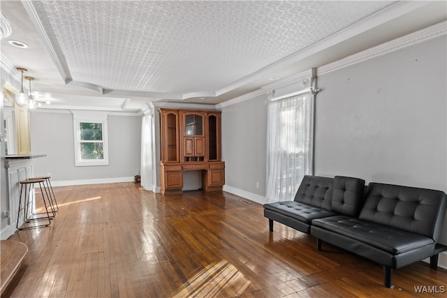 living room featuring a textured ceiling, dark hardwood / wood-style floors, and crown molding