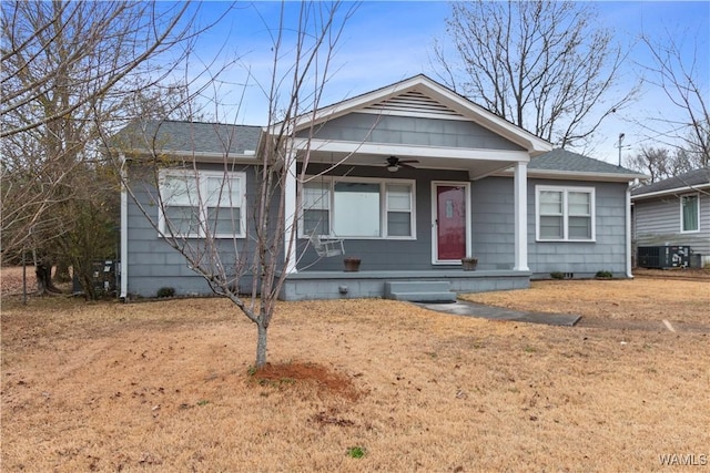 view of front facade featuring covered porch, a front yard, central AC unit, and ceiling fan