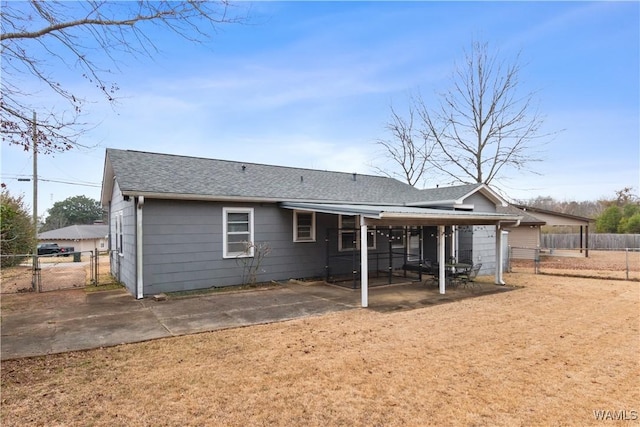 back of house with a patio