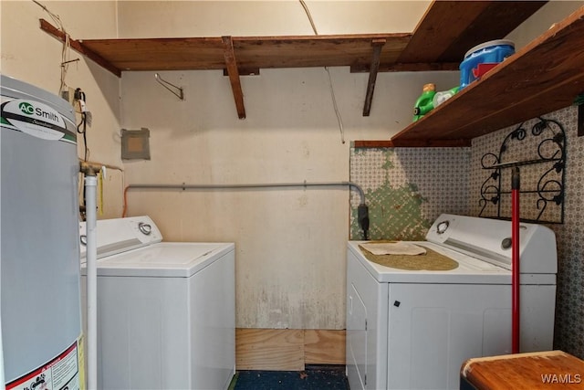 laundry area featuring water heater and separate washer and dryer