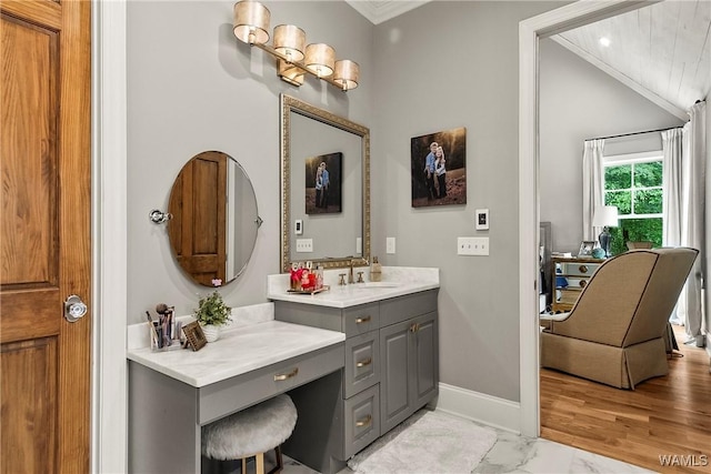 10300 Legacy Ln, Northport, AL 35475 - bathroom with crown molding, marble look tiles, vaulted ceiling, baseboards, and vanity