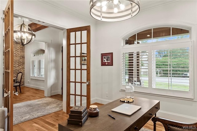10300 Legacy Ln, Northport, AL 35475 - home office featuring a chandelier, wood finished floors, baseboards, and ornamental molding