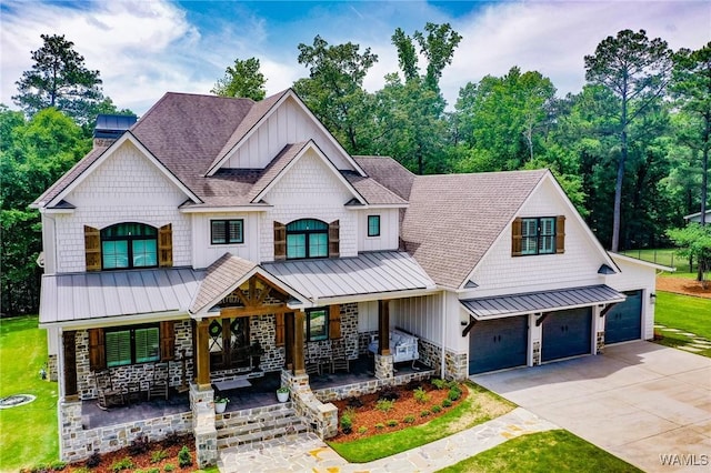 10300 Legacy Ln, Northport, AL 35475 - view of front of property with a standing seam roof, covered porch, stone siding, board and batten siding, and roof with shingles