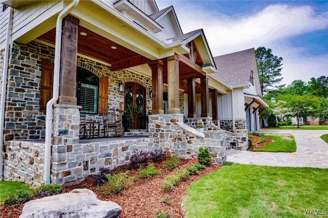 10300 Legacy Ln, Northport, AL 35475 - view of front facade featuring covered porch, stone siding, board and batten siding, and a shingled roof