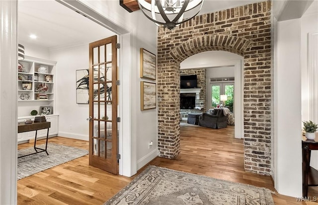 10300 Legacy Ln, Northport, AL 35475 - hall with wood finished floors, ornamental molding, a desk, and baseboards