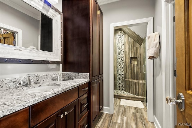 10300 Legacy Ln, Northport, AL 35475 - bathroom featuring a shower stall, wood finished floors, vanity, and baseboards
