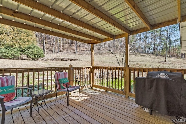 wooden terrace featuring a grill