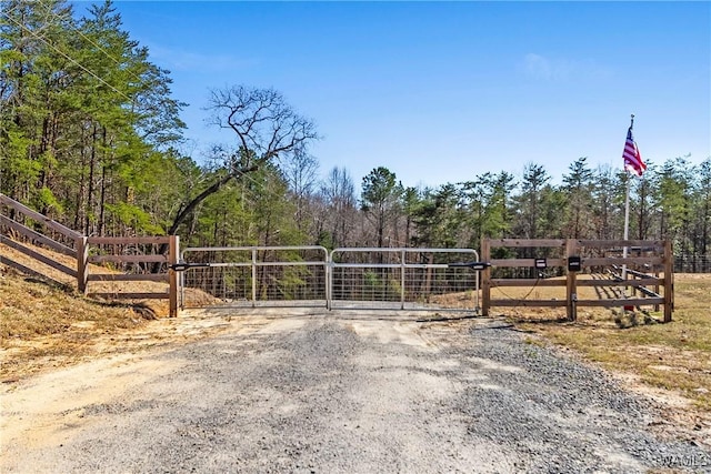 view of gate featuring fence