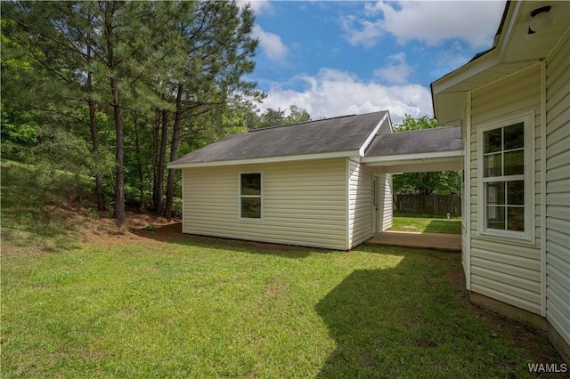 view of outbuilding featuring fence