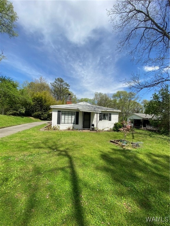 view of front of home with a front yard