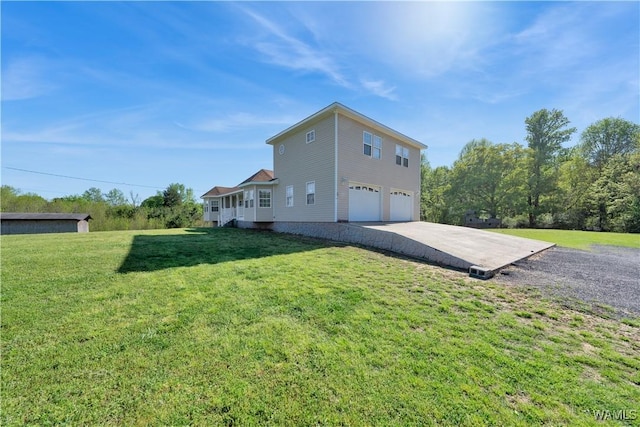 44 Maddox Rd, Nauvoo, AL 35578 - view of side of property featuring an attached garage, a lawn, and concrete driveway