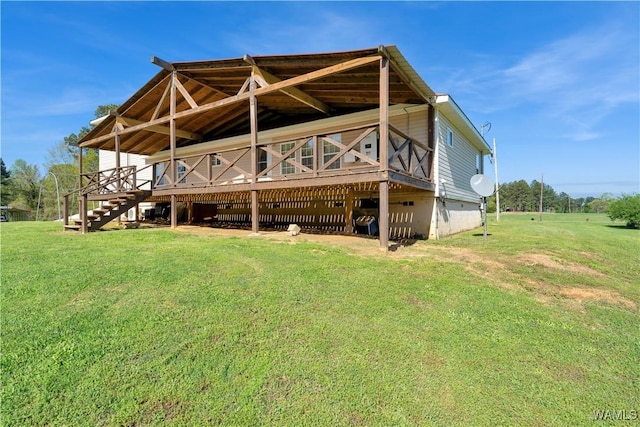 44 Maddox Rd, Nauvoo, AL 35578 - back of house featuring crawl space, a wooden deck, and a lawn