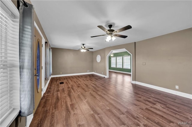 44 Maddox Rd, Nauvoo, AL 35578 - unfurnished room featuring baseboards, a ceiling fan, arched walkways, and wood finished floors