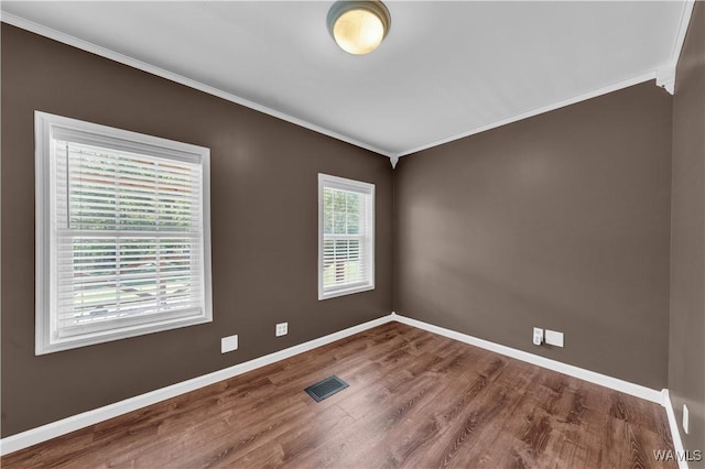 44 Maddox Rd, Nauvoo, AL 35578 - spare room with crown molding, visible vents, baseboards, and wood finished floors