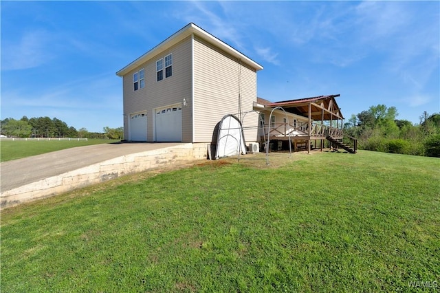 44 Maddox Rd, Nauvoo, AL 35578 - view of side of home with a yard, a garage, driveway, and stairs