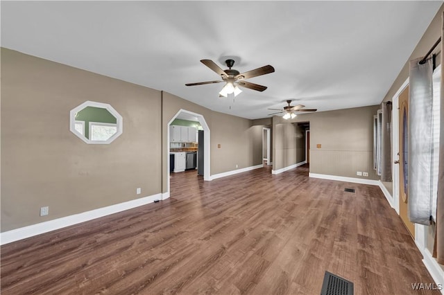 44 Maddox Rd, Nauvoo, AL 35578 - unfurnished living room with arched walkways, wood finished floors, a ceiling fan, and visible vents