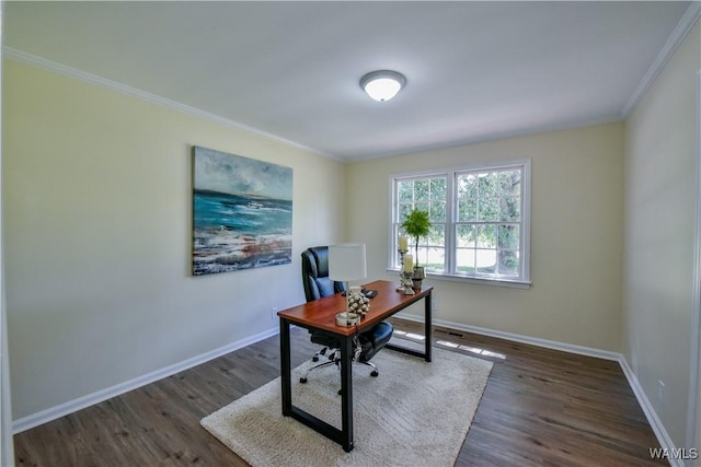 office space with baseboards, wood finished floors, and ornamental molding