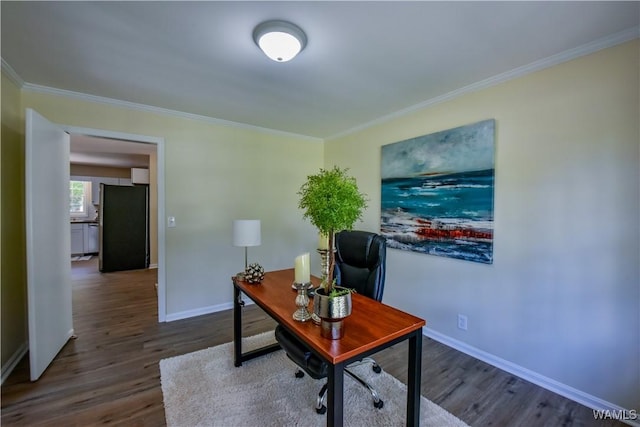 home office featuring ornamental molding, dark wood-type flooring, and baseboards