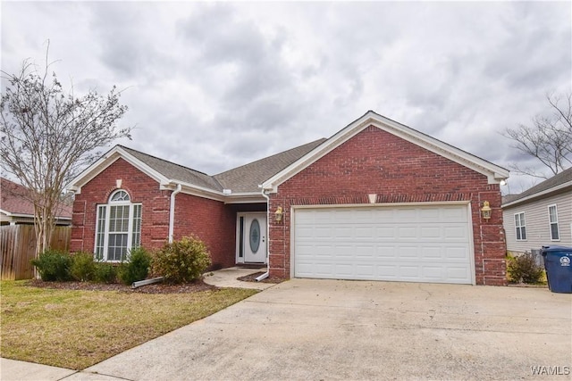 ranch-style home featuring brick siding, fence, a garage, driveway, and a front lawn