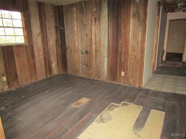 empty room with wood walls