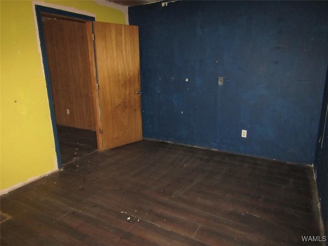 empty room featuring dark wood-style flooring